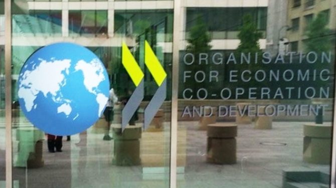 OECD, küresel büyüme tahminleri düşürdü